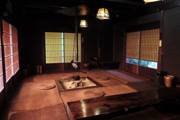 <p>Guests are encouraged to rest in this tranquil space inside the thatched roof building.</p>