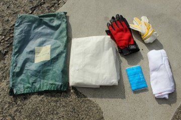 <p>The rental fee includes all these things: a towel, rain poncho and cold weather gloves (for just in case), work gloves, tissues and a lock for the scooter (not pictured). The scooters are always tanked up and you don't have to worry about refilling it</p>