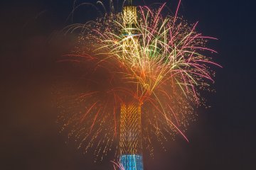 Colorful fireworks in front of the Tokyo Skytree