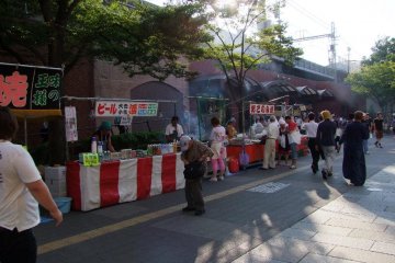 Food vendors just outside JR Kannia Station's South Exit. Exitement builds before the game!