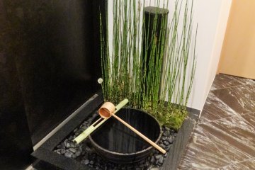 <p>Visitors wash their hands in this basin before entering the tea house</p>
