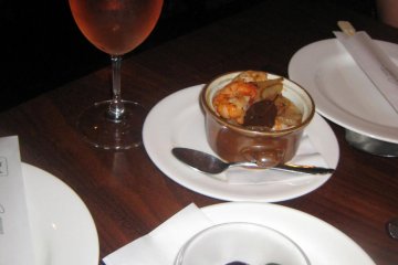 Wine, mystery dish that accidently came to our table for 5 seconds before the waiter realized it was not our order, and my prawns
