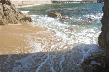Looking out at the beach from inside the cave