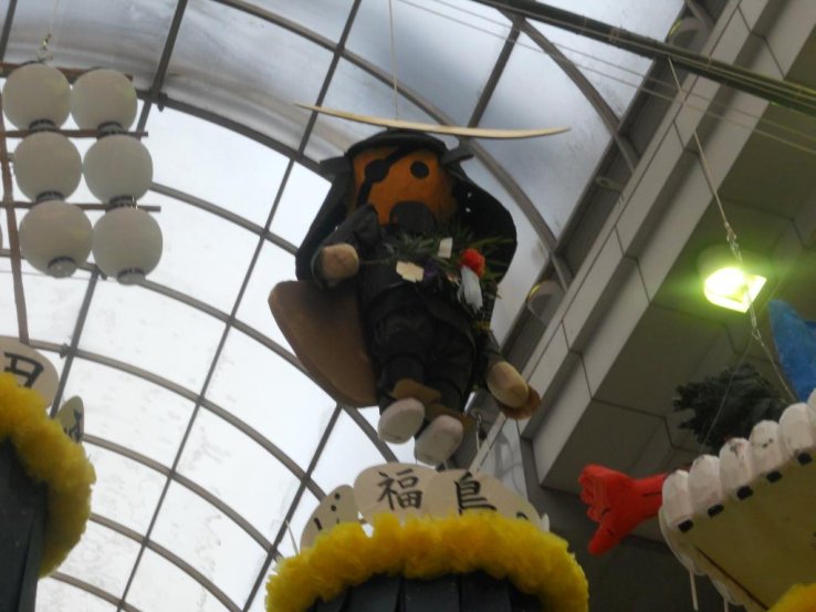 A paper version of lengendary samurai local Masumune Date on Clis Road in Downtown Sendai
