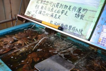 An English sign claims the best prices in the market
