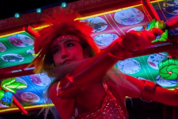 <p>A wild-haired performer</p>
