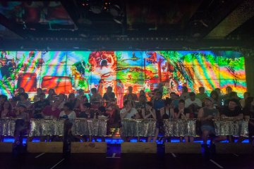 <p>Colorfully illuminated wall, often used to establish the story behind the fighting (yes, there's a story about space robot invaders attacking a peaceful paradise full of innocent girls wearing very little clothing)</p>
