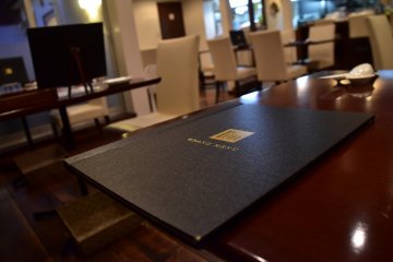<p>The grand menu of Chinese Restaurant FUN. It has a European feel to it, as though it's a French restaurant.</p>
