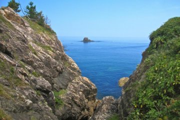 Kuroshima Island outlined by the cliffs