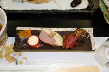 <p>Egg, salmon lox wrapped cream cheese, duck breast with mustard, sweet potato carved like a maple leaf and vegetable stuffed fish</p>
