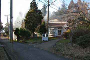 <p>Smoke from locals and Ikoma-Sanjo Amusement Park's grounds keepers burning plant matter blows across the park</p>
