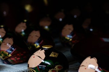 Sunflowers are painted on the side of this doll to reflect the summer seaon
