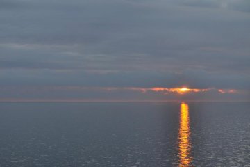 The sun sets as the ferry approaches Hokkaido