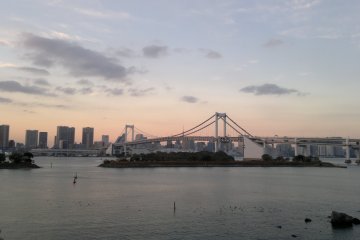 <p>The white color of the bridge starts to shine against the skyline.</p>
