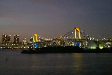 <p>Twilight sky fades, and the rainbow lights are almost fully lit.</p>
