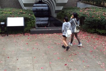 <p>Visitors pay tribute to the memorial.&nbsp;</p>

