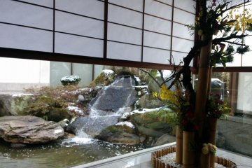 <p>A garden waterfall seen from the lobby, next to the entrance</p>
