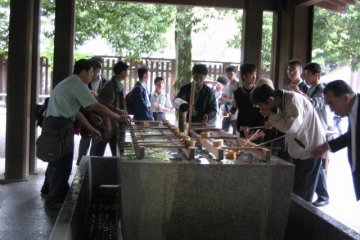 People washing (purifying) before going into the shrine