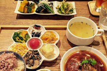 Trying different dishes at Mumokuteki restaurant in Kyoto