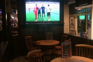 One of the flat screen TVs in the main dining area.