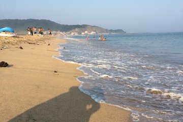 The beach's sand and water are clean.