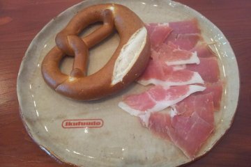 Pretzel and freshly carved Jamon Minakami