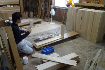 Each employee deals with one step of the furniture making process - here making drawers