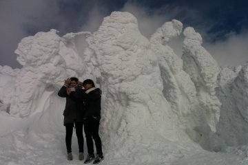 Posing for pictures at the top of the mountain