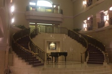 The double staircase in the lobby leading up to the guest rooms.