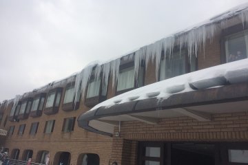 View of the hotel from the outside. The ski lift is just behind me.