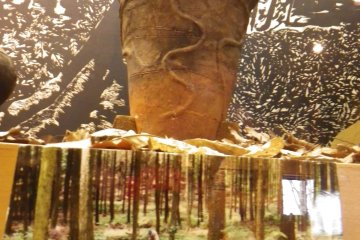 Prehistoric pot and photo showing archeological work