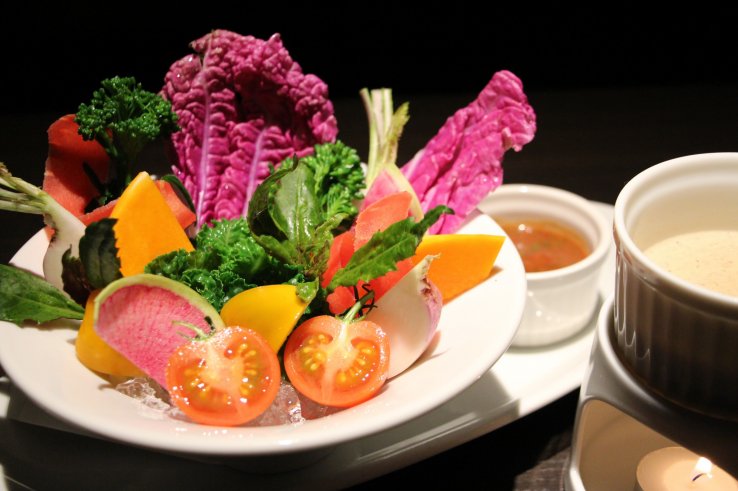 Organic vegetable selection with two types of dipping sauces, plum and anchovy garlic
