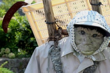 Kaminada's scariest scarecrow scowls and carries farm tools which look more like menacing weapons!