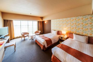 Twin rooms with a lounge and balcony
