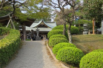 Manicured gardens and classical architecture.