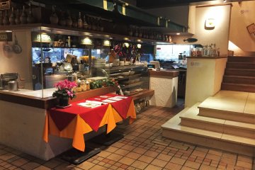 The downstairs is where the kitchen is. Orders are sent up via dumbwaiter.