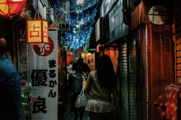 Visitors make their way through the busy narrow alleyways