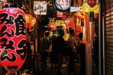 Lanterns and shop lights at Harmonica Alley