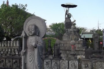 The statues face in every direction