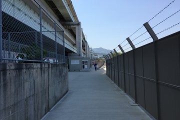 All the barbed wire makes it feel rather austere and maybe even a little prison-like