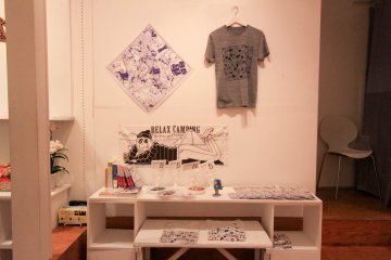 Prints on cloths, button pins, and books