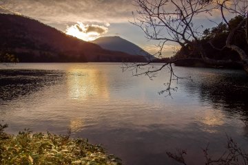 A view from the lake’s western shore with Mount Oku-Shirane in the background