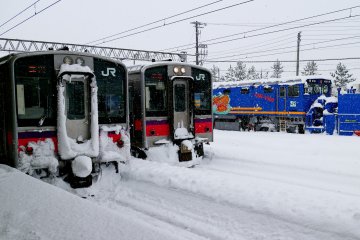 JR trains parked on its platform in Aomori during winter