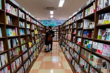 A couple browsing through Japanese books