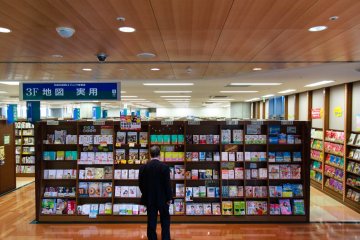 Man choosing a book to read