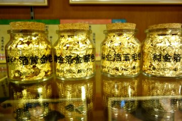 The offcuts of gold leaf squares do not go to waste