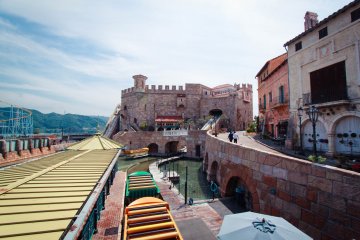 A water coaster slide is beside the Spanish castle