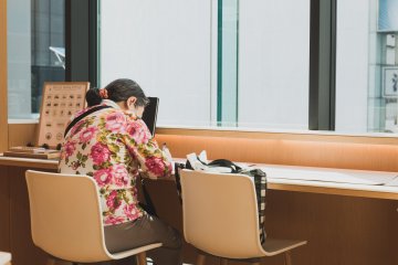 Someone writing a letter