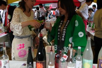 Having a little taste...you always pour for your friends first!