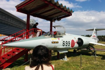 Jets and planes are parked behind the museum